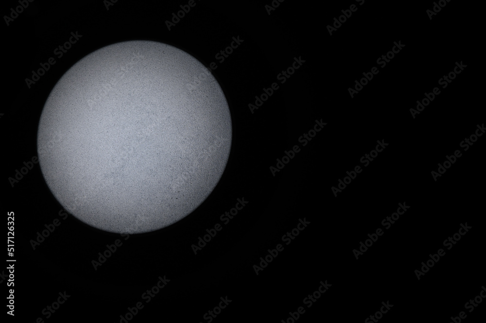 Gray Textured Background. Black Background with Round Beam of Light on Left Side. Copy Space.