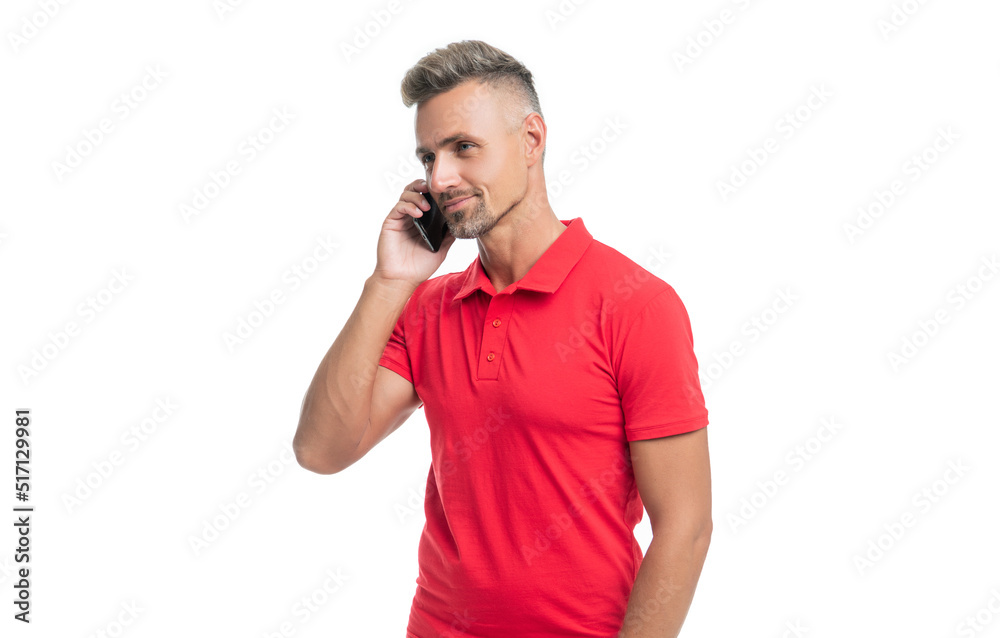 mature man in red tshirt speaking on smartphone isolated on white background mature man in red tshirt speaking on smartphone isolated on white background