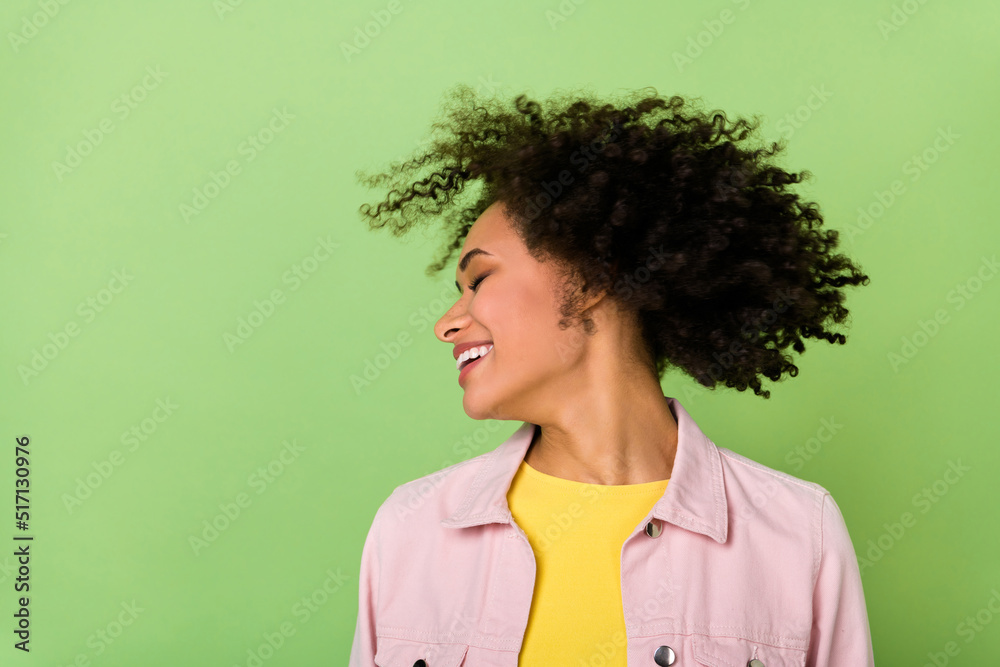 Portrait of good mood sweet girl spin head with closed eyes laughing daydreaming isolated on green color background Portrait of good mood sweet girl spin head with closed eyes laughing daydreaming isolated on green color background