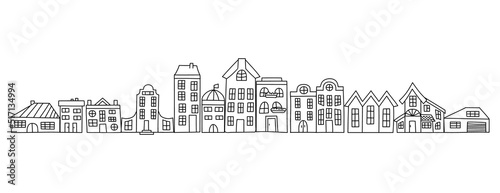 Set of hand drawn houses. Vector illustration in doodle style. Isolated on a white background.