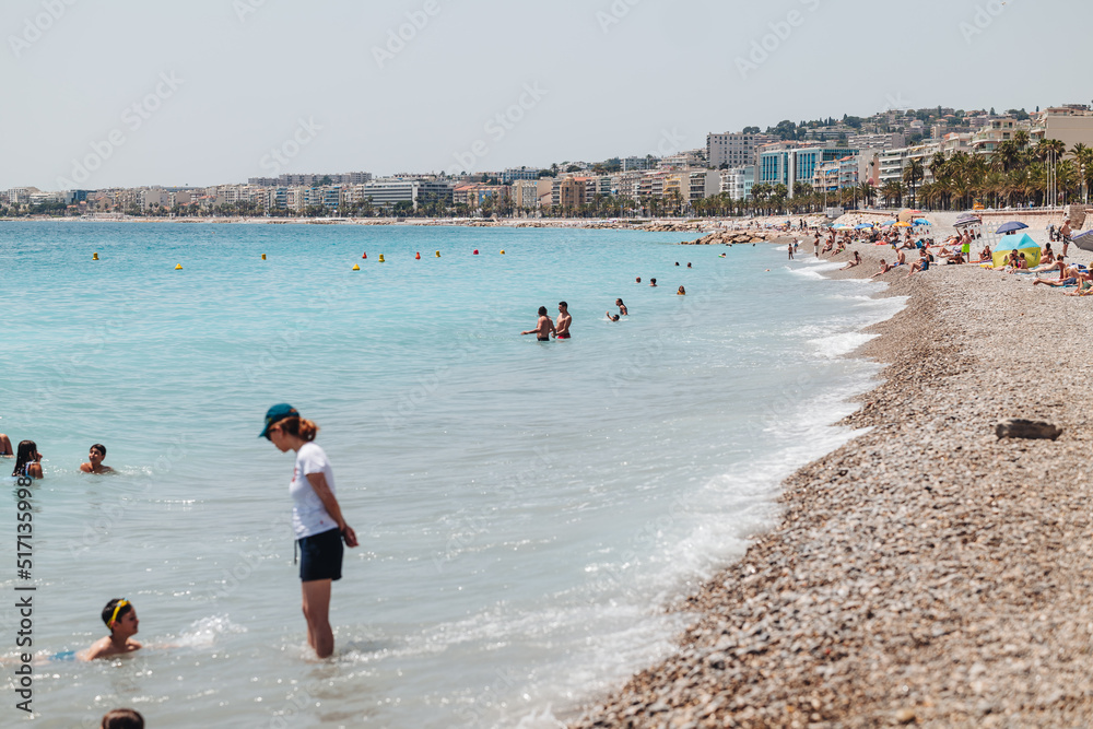 Nice, France-June 2022: life by The beautiful stone beach Nice, France-June 2022: life by The beautiful stone beach