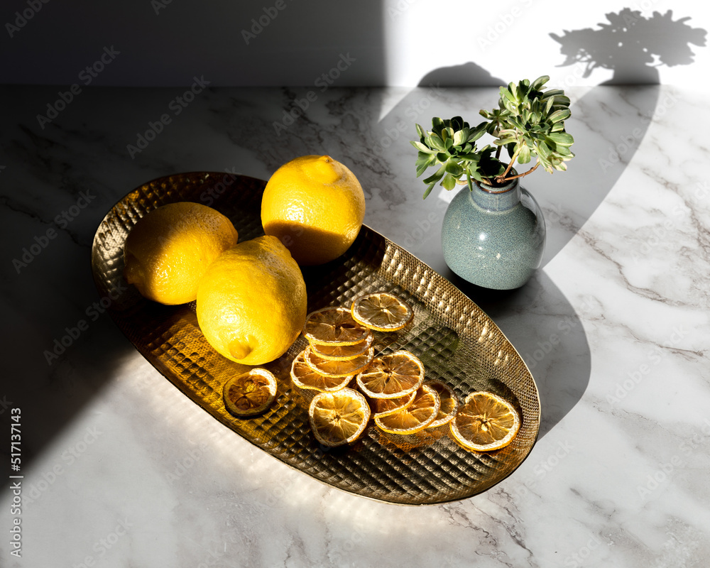lemons on gold tray