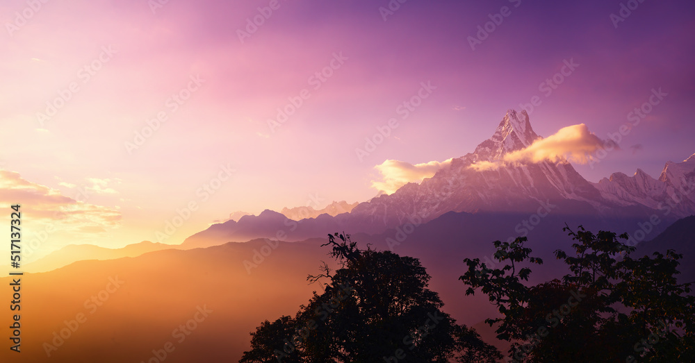 Scenic panoramic view landscape with mountain peak Machapuchare, Nepal on sunrise.