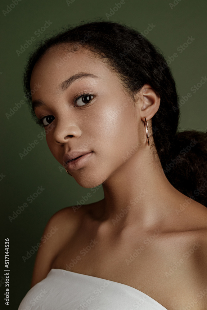 Beauty photo of young elegant African American woman with afro. Hands posing. Gentle portrait. Fashion beauty close up portrait. Nude make-up. Studio photoshoot. Female model. Beautiful girl Beauty photo of young elegant African American woman with afro. Hands posing. Gentle portrait. Fashion beauty close up portrait. Nude make-up. Studio photoshoot. Female model. Beautiful girl