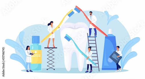 Stomatology, dentistry. Tiny Dentists standing around big tooth and cleaning, treating unhealthy teeth with caries cavity. Doctors brushing, clean plaque. Dental examination. Dentist appointment