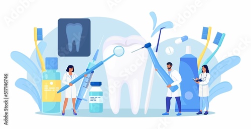 Dentists cleaning and treating big unhealthy tooth with caries cavity. Toothache. Stomatology, Dentistry concept. Doctors with professional instruments for check up and treatment. Dentist appointment