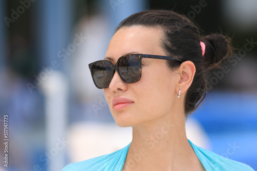 portrait of a pretty brunette in black glasses © serikbaib