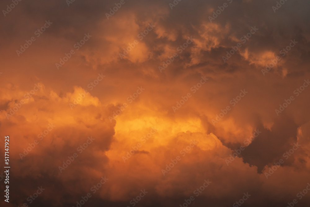 Beautiful sunset sky with dramatic orange clouds.