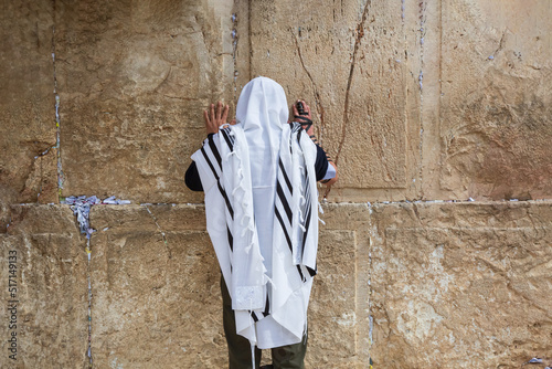 Jewish man praying at the Western wall photo