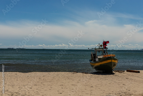 Fototapeta Naklejka Na Ścianę i Meble -  Fishing boat on the beach in Gdynia Orlowo