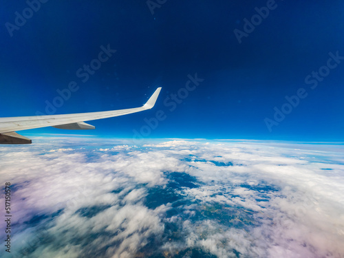 Fototapeta Naklejka Na Ścianę i Meble -  View from an airplane window onto clouds