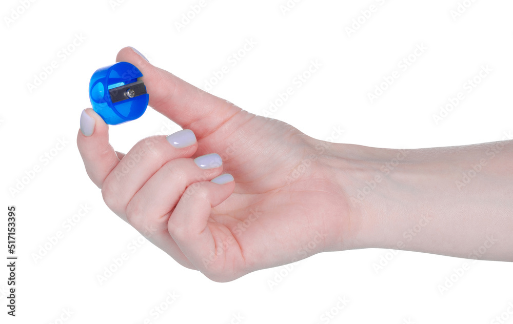 Round pencil sharpener in hand on white background isolation Round pencil sharpener in hand on white background isolation