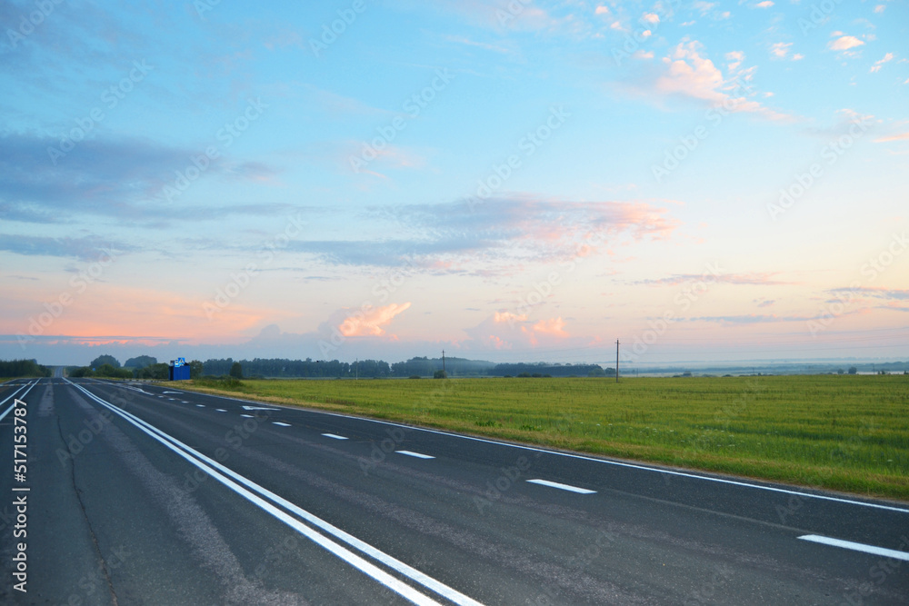 Empty highway in the early morning in the field