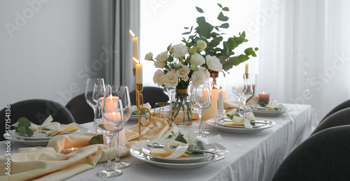 Festive table setting with beautiful floral decor in restaurant. Banner design