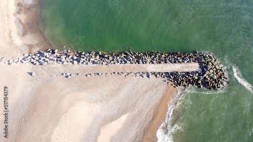 Obraz na plátne Aerial view of a groyne on a beach, breakwater, coastal protection, climate chan