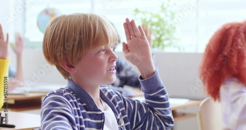 Wallpaper Mural Cute boy in casual wear raising hand and answering teacher's question during lesson at school. Smart preteen male pupil wanting to get good grades. Torontodigital.ca