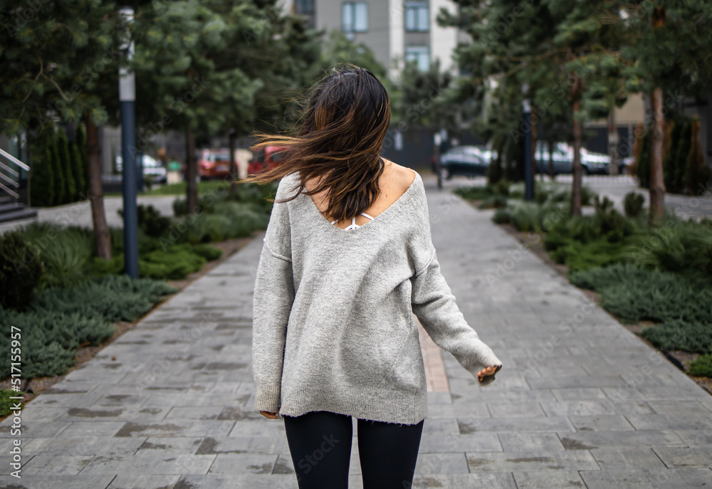 windy weather, hairs close woman's face, sad mood and cold weather