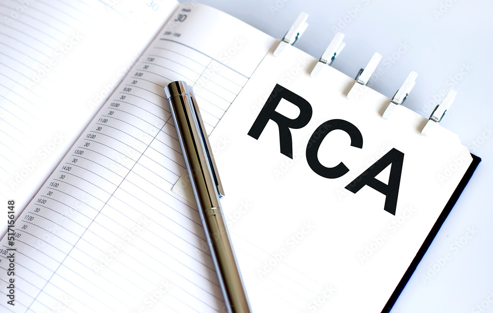 text RCA on the short note texture background with pen