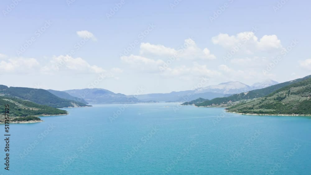 Aerial drone shot of breathtaking turquoise lake and mountains. Lake Kremaston at Central Greece. Aerial drone shot of breathtaking turquoise lake and mountains. Lake Kremaston at Central Greece.