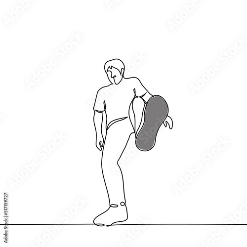 man swung to kick the viewer or step on him - one line drawing vector. concept giant, domineering influencer