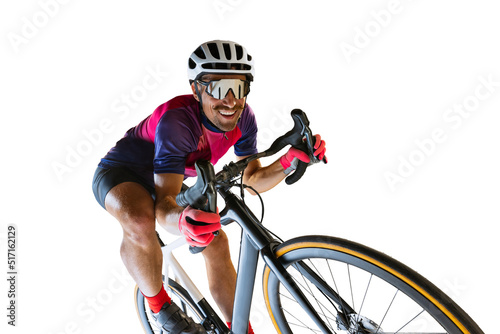 Portrait of man, professional cyclist training, riding isolated over white studio background