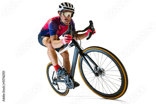 Portrait of man, professional cyclist training, riding isolated over white studio background. Concentration photo
