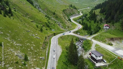 Transfagaras flew over the highway with cars overlooking the mountains photo