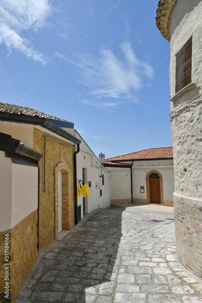 A street between the old houses of Tricarico, a rural village in the Basilicata region, Italy.