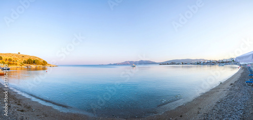 Crystal clear turquoise water in a bay. Charaki in the past small fishing village on the east coast of the island of Rhodes now an beach resort. Vacation on Greece islands in and Mediterranean sea.