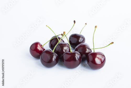 Closeup on ripe red sweet cherry on the white background
