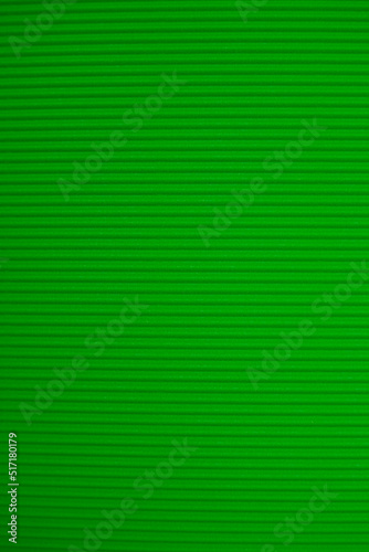 Abstract background made of corrugated paper for green application. Space for text. Texture. Horizontal stripes.