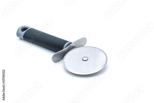 metal pizza cutter with black handle on white background