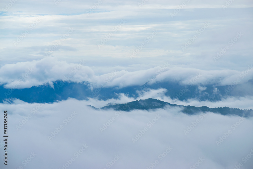 Beautiful view of foggy morning in the mountains covered with white clouds