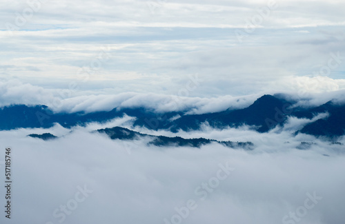 landscape with peaks covered by snow and clouds, mountains covered with white clouds © Sourav
