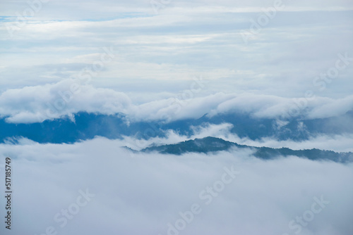 Beautiful view of foggy morning in the mountains covered with white clouds