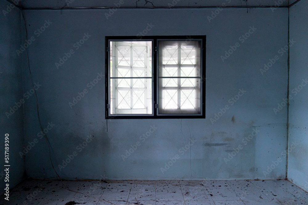 window inside the house with the environment of the house that is dirty and dark. abandoned buildings.