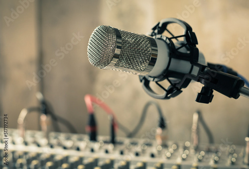 Microphone and sound mixer at desk table. Music audio concept in sound record studio © Svitlana