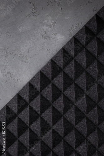 Acoustic soundproof foam at cement wall background texture. Sound isolation material for studio