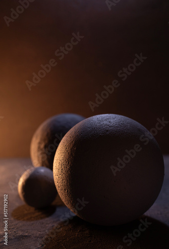Cement sphere against concrete wall at floor. Abstract geometric or space concept