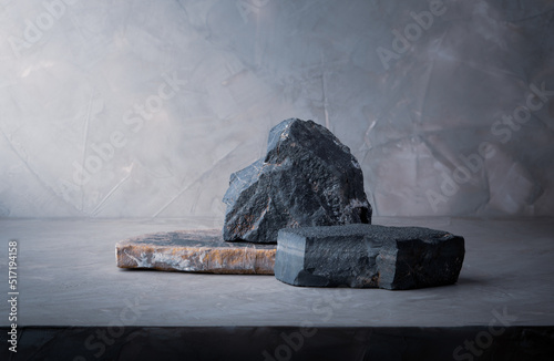 dark stone podium stage, stone composition for show product packaging and cosmetic on gray concrete wall background, copy space