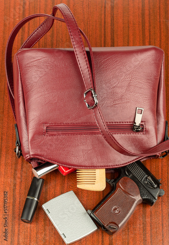 From a woman's handbag to the table, cosmetic accessories and a Makarov pistol.