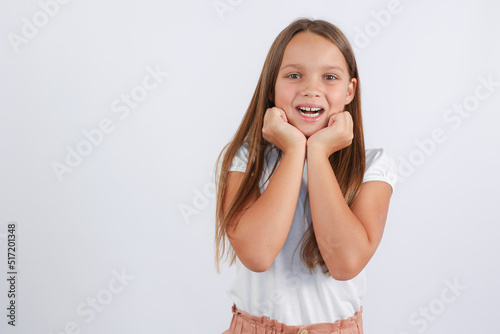 girl looks at the camera and shows her teeth. High quality photo