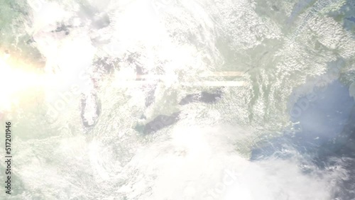 Earth zoom in from outer space to city. Zooming on Milton, Ontario, Canada. The animation continues by zoom out through clouds and atmosphere into space. Images from NASA photo
