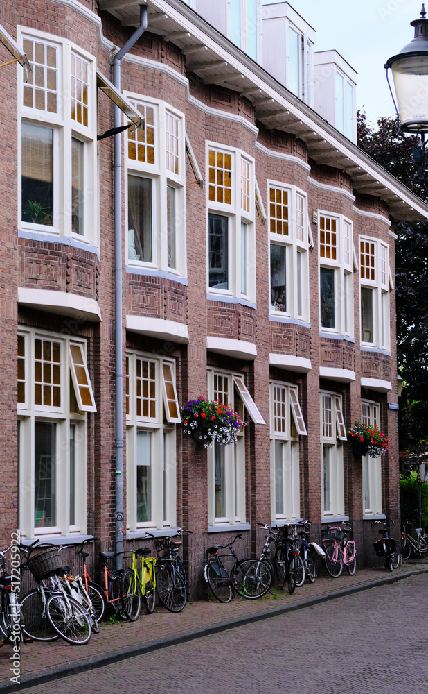 Amersfoort, The Netherlands, July 6, 2022. A row of six identical houses with bicycles outside.