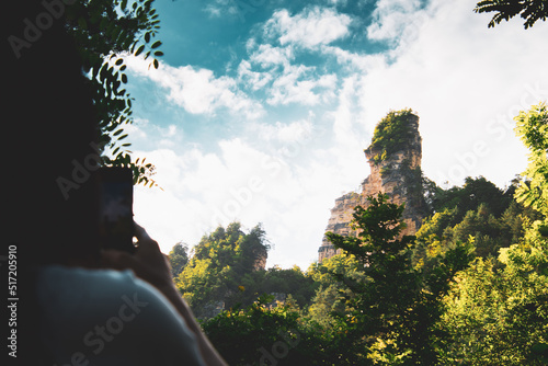 Female person take photo of Sairme pillars in summer with sky background. Hidden gem in Georgia photo