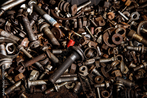 Set of the female screw and bolts. Iron texture background.