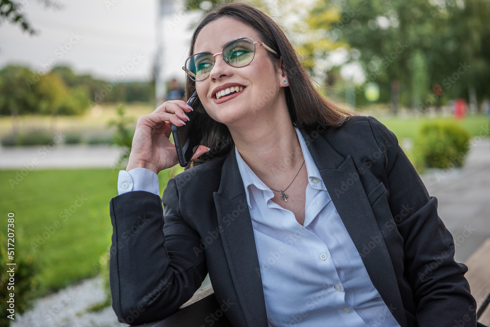 Business woman of the 21st century. A young girl works in the park. Flexible working hours. Modern young girl. Business woman of the 21st century. A young girl works in the park. Flexible working hours. Modern young girl.