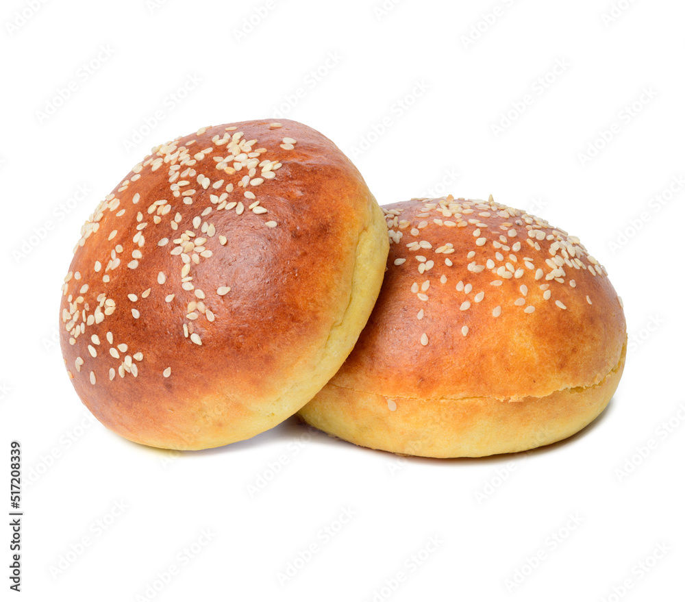 Whole round bun made of white wheat flour with sesame seeds isolated on white background