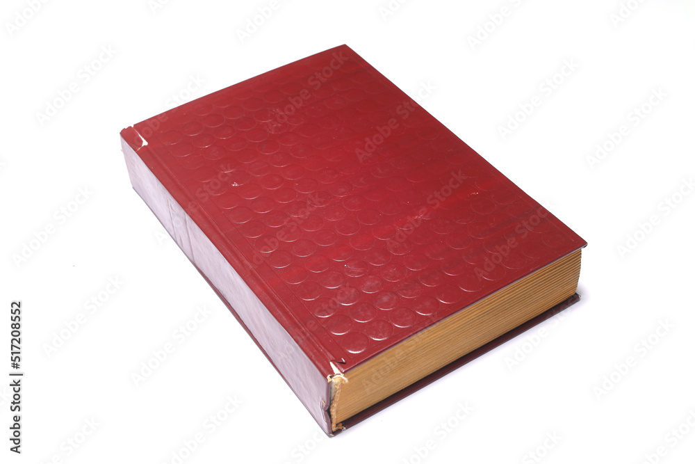 Old Red book isolated on white background. close up book. Old Red book isolated on white background. close up book.