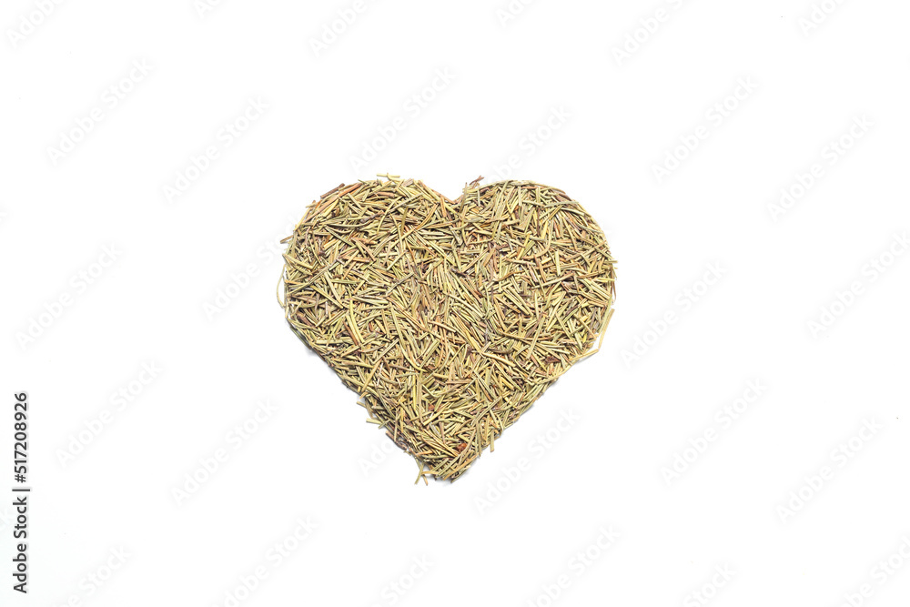 Heart shape rosemary herbs on a white background. Dried herbs, seasonings. Flat lay. Heart shape rosemary herbs on a white background. Dried herbs, seasonings. Flat lay.